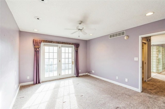 carpeted empty room with ceiling fan