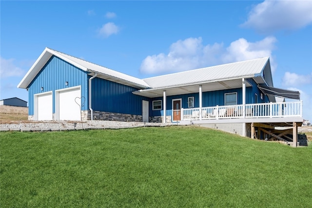 view of front facade with a front lawn, a garage, and a porch