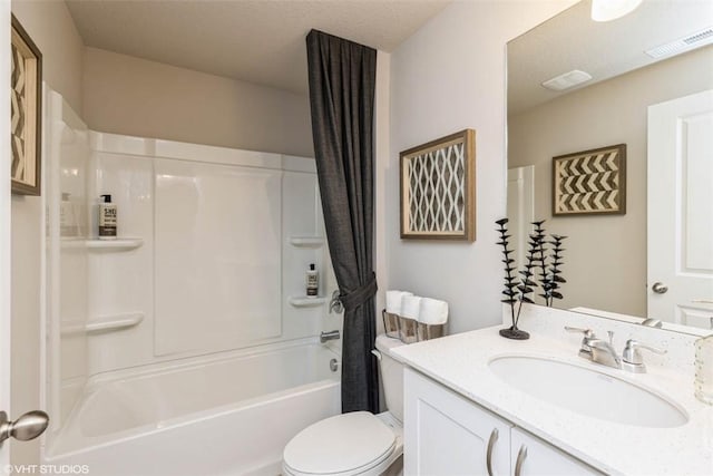 full bathroom with vanity, shower / bath combo with shower curtain, and toilet