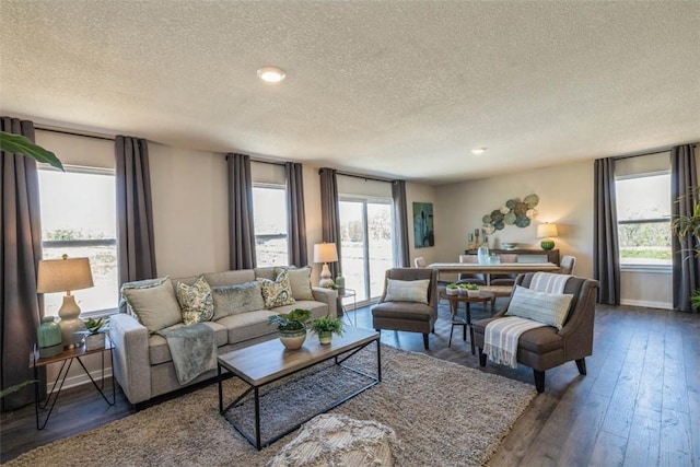 living room featuring a textured ceiling and plenty of natural light