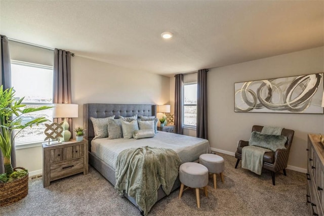 bedroom featuring multiple windows and carpet flooring