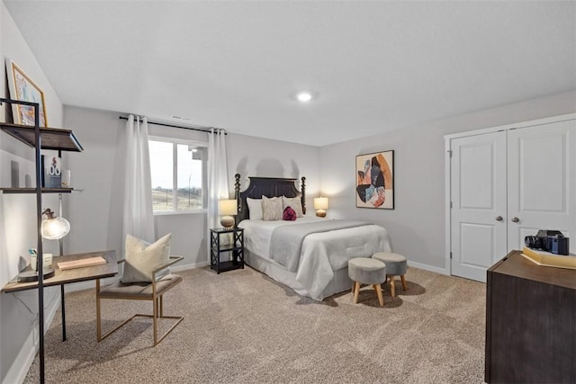 carpeted bedroom with a closet