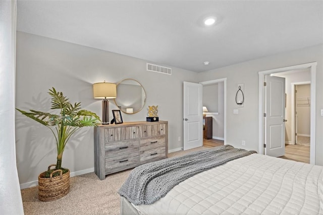 bedroom with light colored carpet