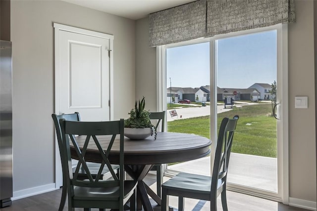 dining room with hardwood / wood-style floors