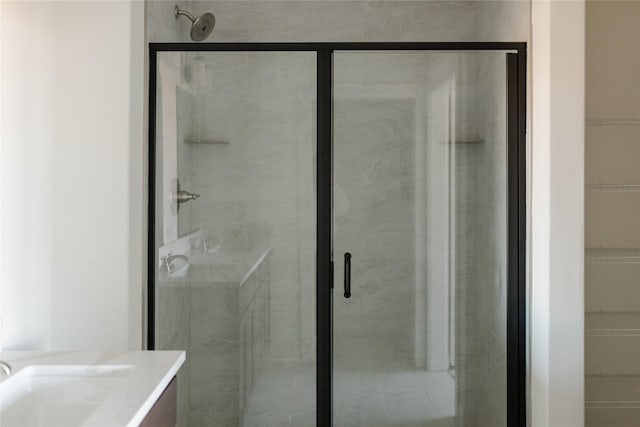 bathroom featuring a shower with door