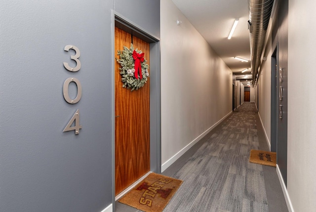 corridor featuring dark wood-type flooring