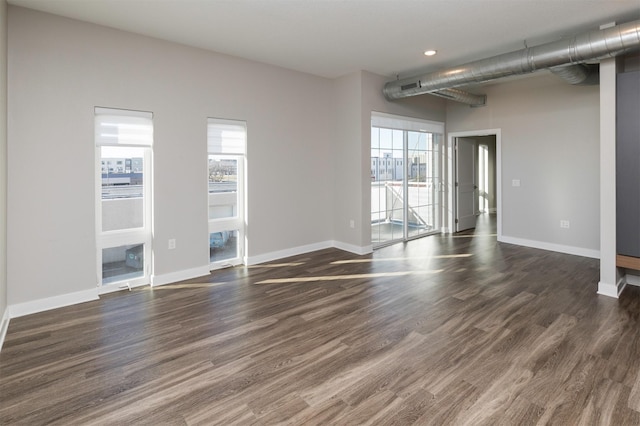 unfurnished room featuring dark hardwood / wood-style flooring