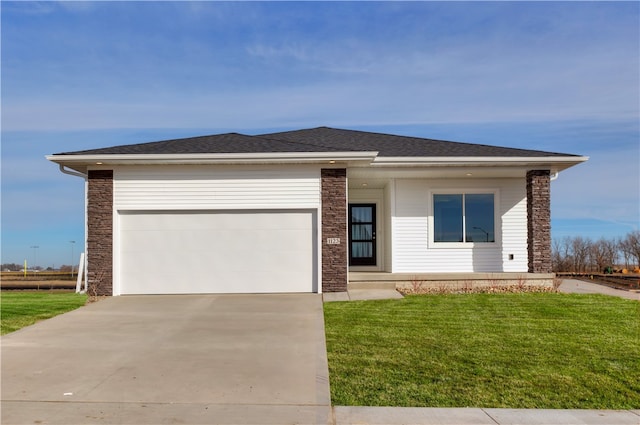 ranch-style house with a front yard and a garage