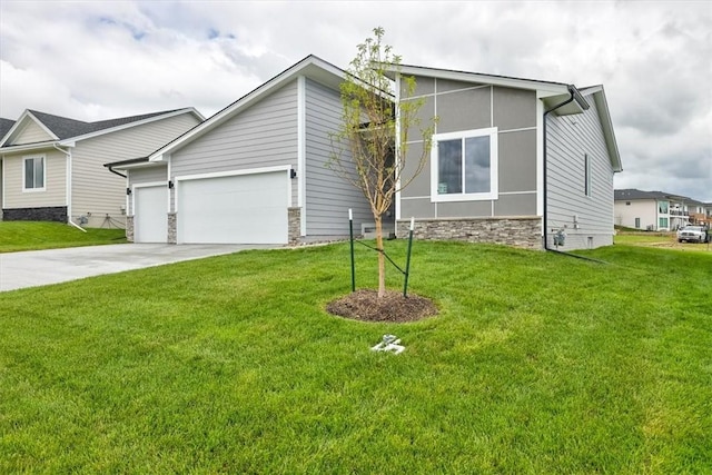 view of front of property with a garage and a front yard