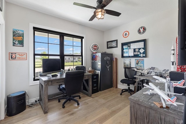 office space featuring ceiling fan and light wood-type flooring