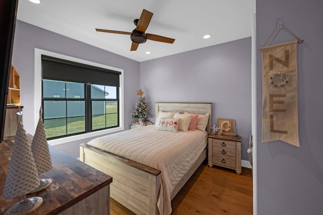 bedroom featuring hardwood / wood-style floors and ceiling fan