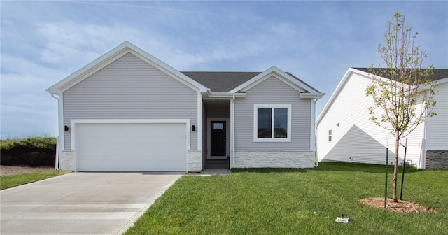 view of front of house with a front yard and a garage