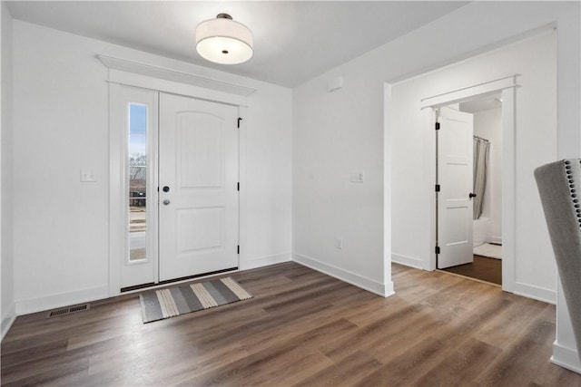 foyer entrance featuring dark hardwood / wood-style flooring