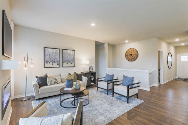 living room with dark hardwood / wood-style floors