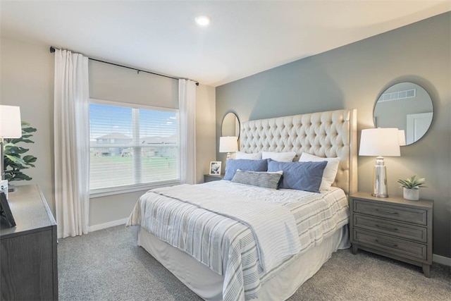 bedroom featuring light carpet