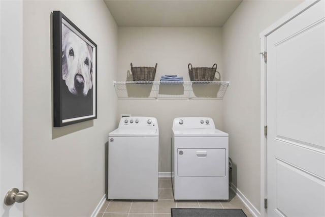 clothes washing area featuring independent washer and dryer and light tile floors