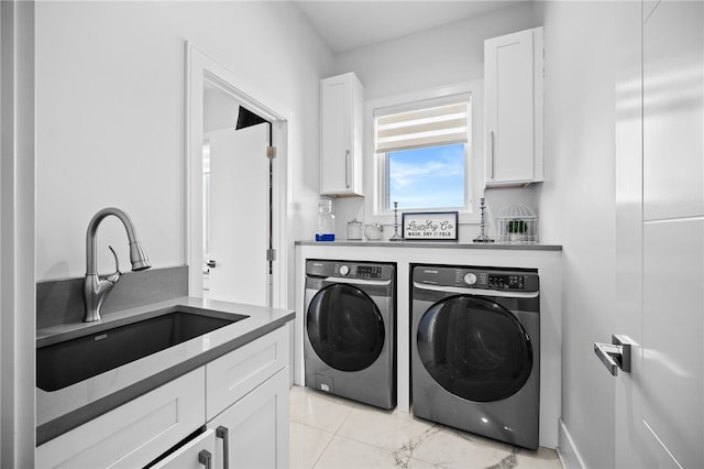 washroom featuring sink and independent washer and dryer