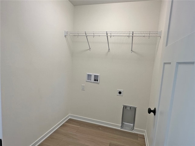 washroom featuring electric dryer hookup, washer hookup, and wood-type flooring