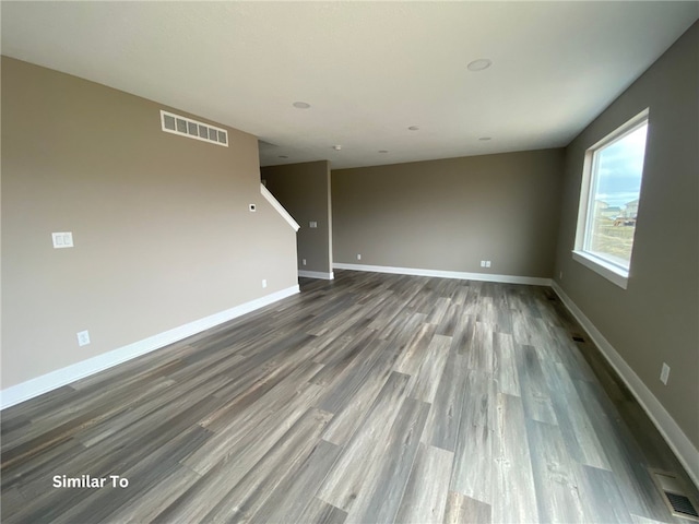 empty room featuring hardwood / wood-style flooring