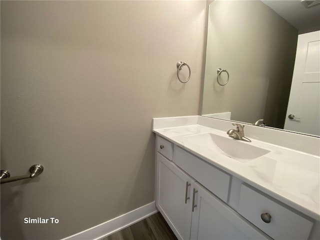 bathroom featuring wood-type flooring and vanity