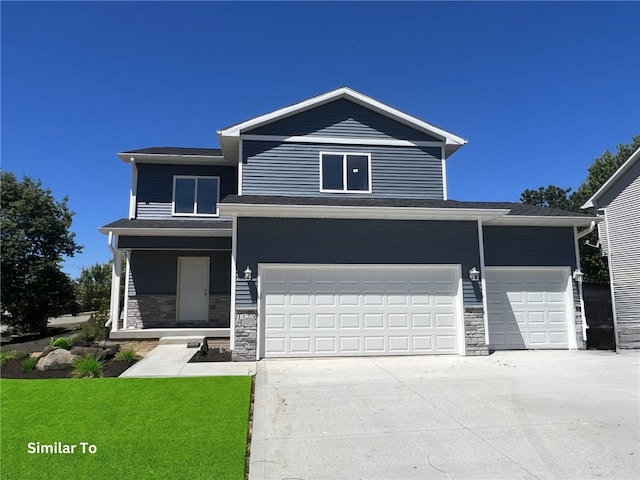 view of front facade featuring a garage and a front yard