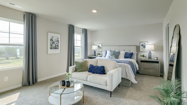 bedroom with light colored carpet