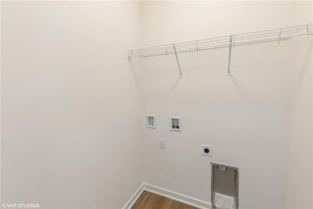 washroom with hookup for an electric dryer, wood-type flooring, and washer hookup