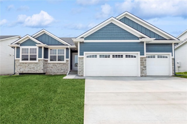 craftsman-style house with a garage, stone siding, and board and batten siding