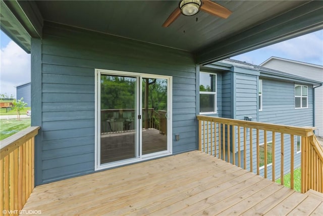 wooden terrace featuring ceiling fan