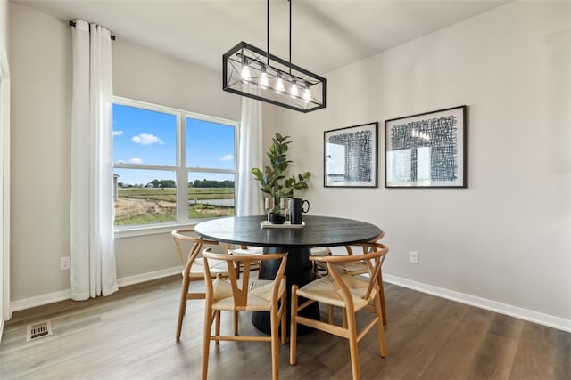 dining space featuring hardwood / wood-style flooring