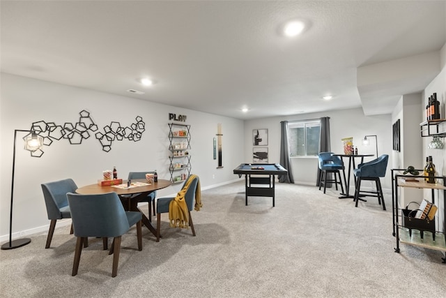 view of carpeted dining area