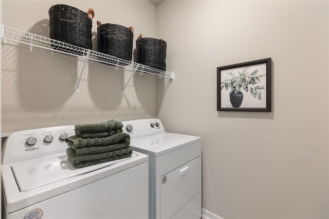 washroom with independent washer and dryer