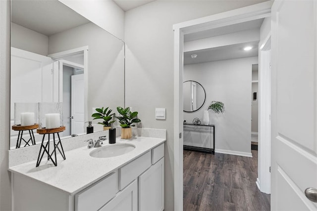 bathroom with vanity and hardwood / wood-style flooring