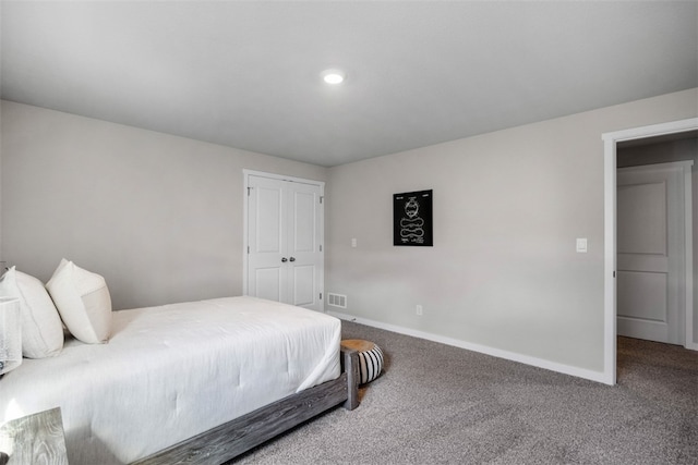 carpeted bedroom featuring a closet