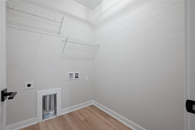 laundry area with hookup for an electric dryer, washer hookup, and wood-type flooring