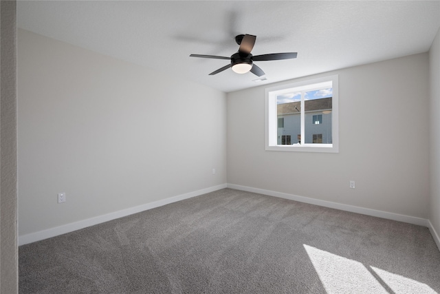 spare room with carpet and ceiling fan