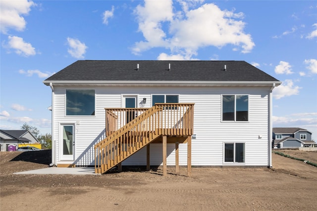 rear view of house featuring a deck