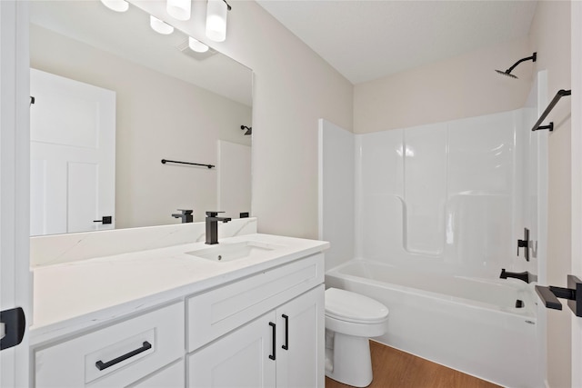 full bathroom featuring shower / bathtub combination, vanity, toilet, and hardwood / wood-style floors