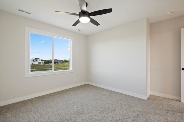 spare room with ceiling fan and carpet flooring