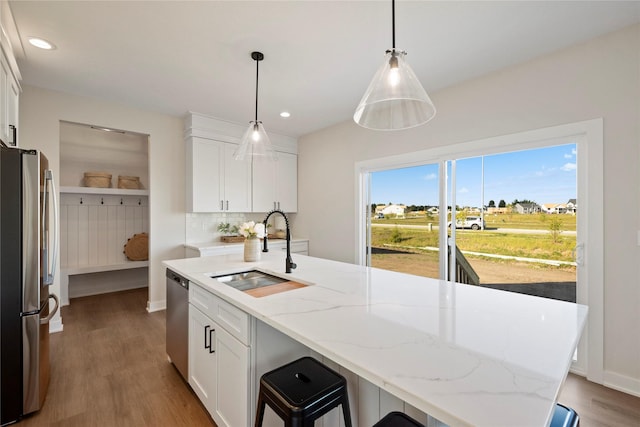 kitchen with white cabinetry, appliances with stainless steel finishes, and sink