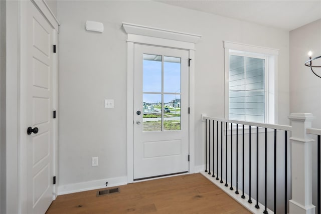 doorway to outside with hardwood / wood-style flooring