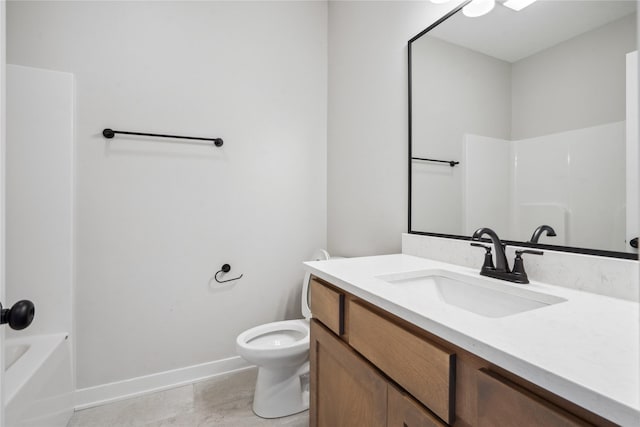 full bathroom featuring vanity, bathtub / shower combination, and toilet