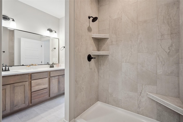 bathroom featuring vanity and a tile shower