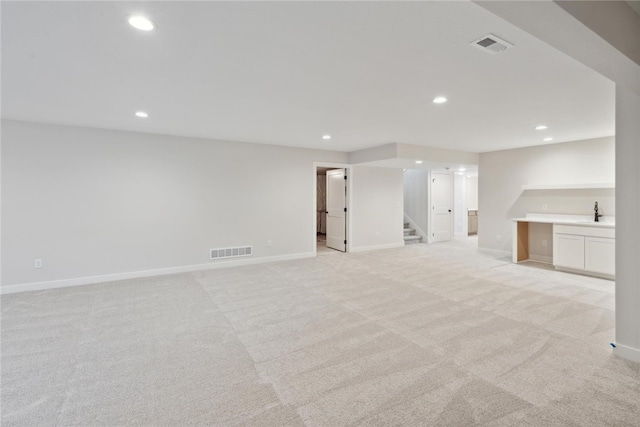 basement with light colored carpet