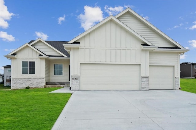 view of front of house with a garage and a front lawn