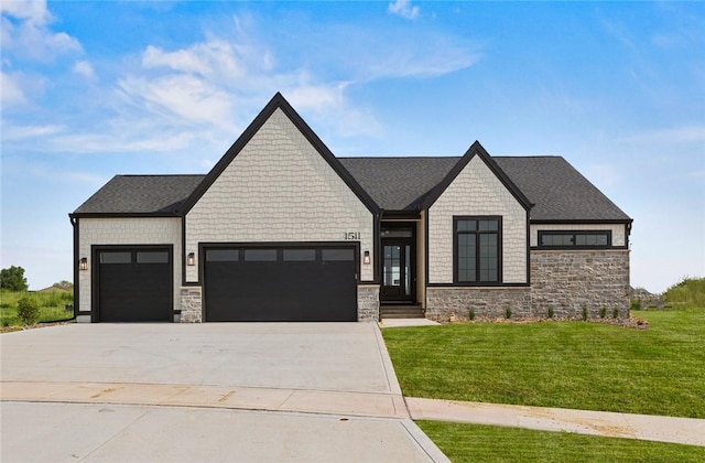 view of front facade featuring a garage, concrete driveway, a front lawn, and stone siding