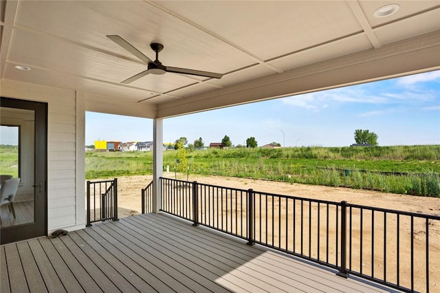 deck featuring a rural view and a ceiling fan