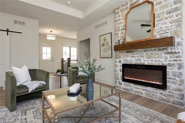 living room with a fireplace and hardwood / wood-style floors