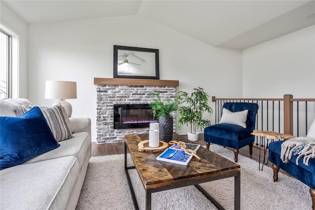 living room featuring lofted ceiling, ceiling fan, and hardwood / wood-style floors
