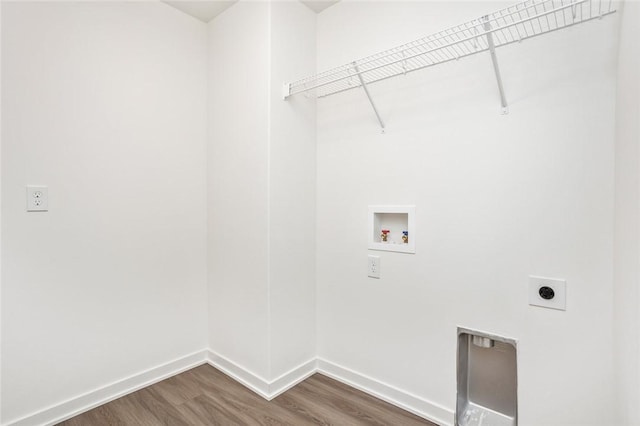 clothes washing area with dark hardwood / wood-style flooring, hookup for an electric dryer, and washer hookup